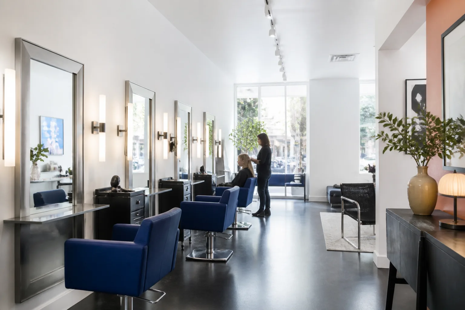 Bright modern hair studio with cobalt blue details